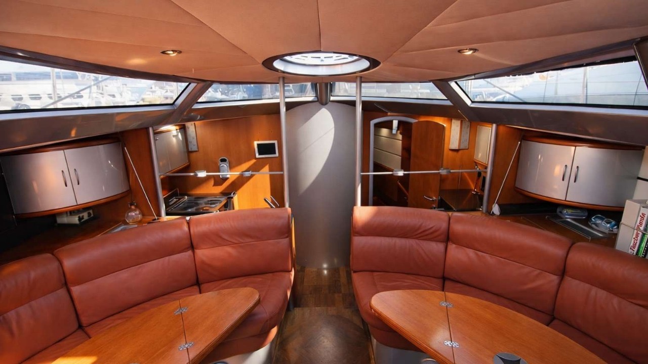 Saloon — Panoramic windows · Leather settees · Full galley